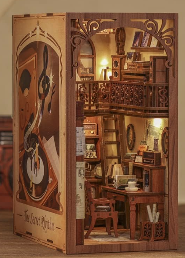 Diorama of a reading corner with a cat.